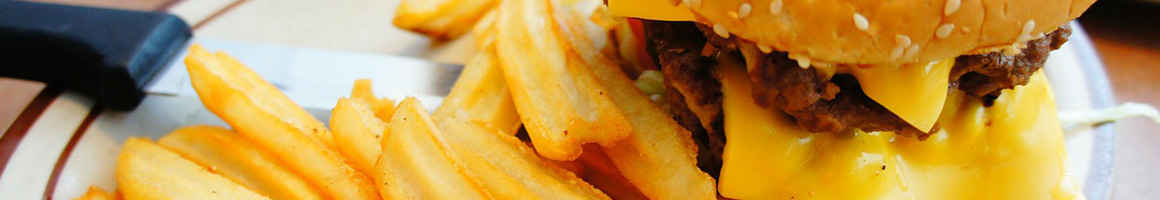 Eating American (Traditional) Burger Pub Food at Tomboy Tavern restaurant in Telluride, CO.